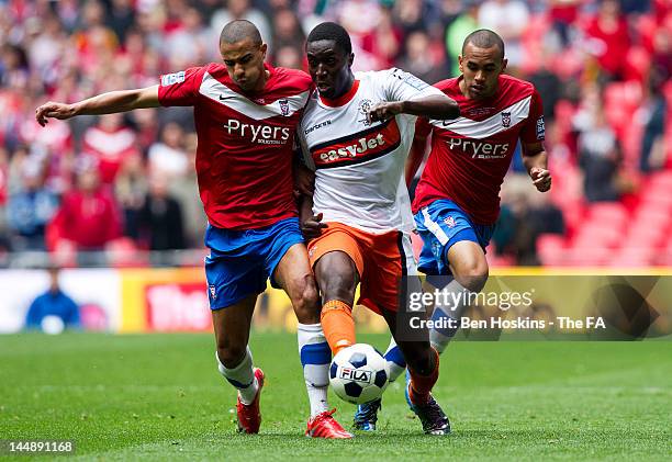 Curtis Osano of Luton passes under pressure from James Meridith and Ashley Chambers of York during Blue Square Bet Premier League Play Off Final...