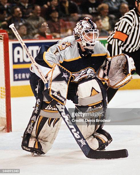 Mike Dunham of the Nashville Predators follows the action during a game against the Montreal Canadiens Circa 2002 at the Bell Centre in Montreal,...