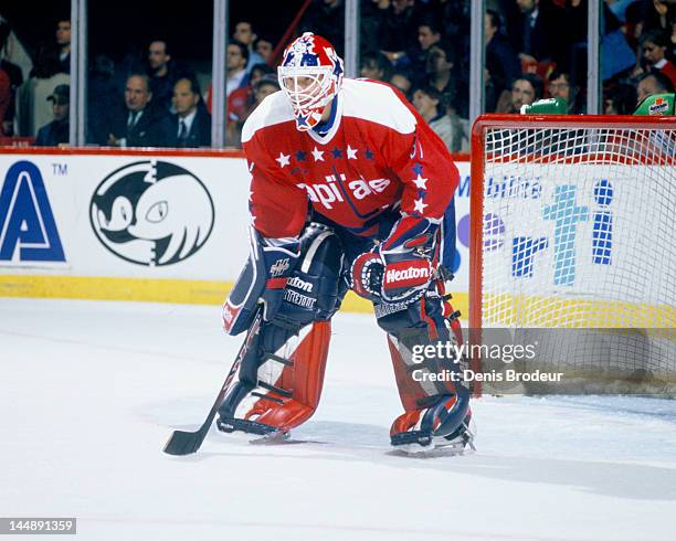 Olaf Kolzig of the Washington Capitals follows the action during a game against the Montreal Canadiens Circa 1993 at the Montreal Forum in Montreal,...