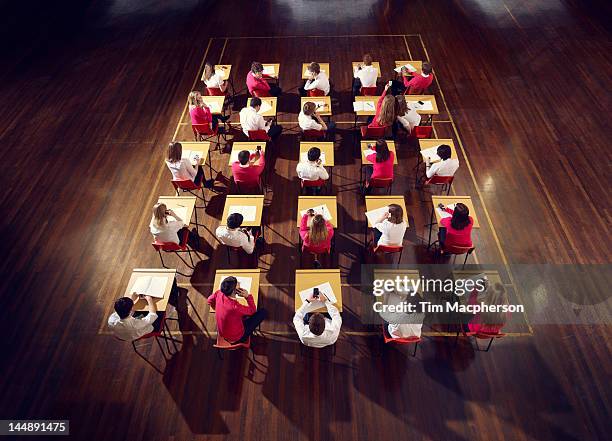 teenagers use mobile phones in exam - dorset uk stock-fotos und bilder