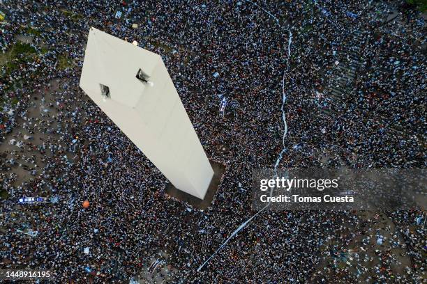 Aerial view as Argentine fans gather to celebrate at the Obelisk after their team's victory in the semi-final match of FIFA World Cup Qatar 2022...