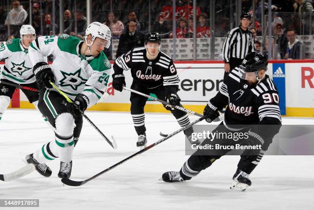 First period shot by Roope Hintz of the Dallas Stars deflects off the stick of Tomas Tatar of the New Jersey Devils at the Prudential Center on...
