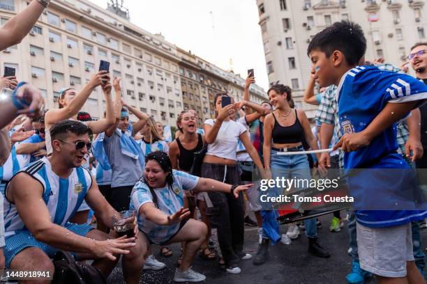 Fans of Argentina celebrate at the Obelisk after their team's victory in the semi-final match of FIFA World Cup Qatar 2022 between Argentina and...