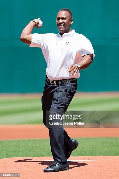Former Indians great Joe Carter throws out the first pitch prior to the game between the Cleveland Indians and the Miami Marlins during inter-league...