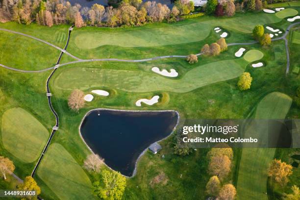 aerial of golf course in a suburb of new york city, usa - golfplatz stock-fotos und bilder