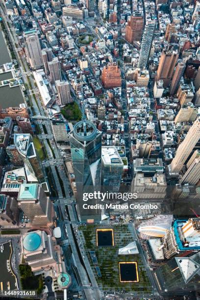 aerial of one world trade center and 9/11 memorial, new york, usa - one world trade center aerial stock pictures, royalty-free photos & images