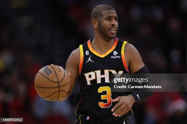 Chris Paul of the Phoenix Suns controls the ball against the Houston Rockets during the first half at Toyota Center on December 13, 2022 in Houston,...