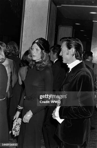 Paulene Stone and Laurence Harvey attend an event benefiting the Thalians at the Century Plaza Hotel in Los Angeles, California, on October 9, 1972.