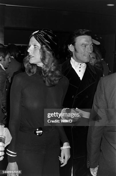 Paulene Stone and Laurence Harvey attend an event benefiting the Thalians at the Century Plaza Hotel in Los Angeles, California, on October 9, 1972.