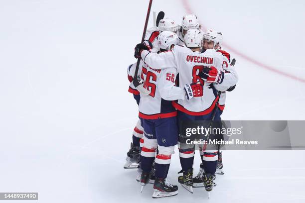 Alex Ovechkin of the Washington Capitals celebrates with teammates after scoring a goal against the Chicago Blackhawks, his 798th career goal, during...