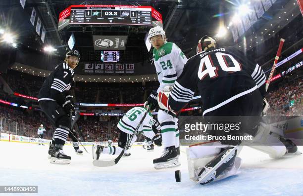 Roope Hintz of the Dallas Stars scores the game-winning goal at 19:57 of the second period against Akira Schmid of the New Jersey Devils at the...