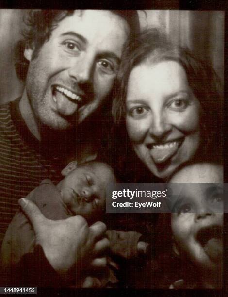 silly young family in a photobooth making silly faces, with a toddler and newborn baby - photo strip stock pictures, royalty-free photos & images