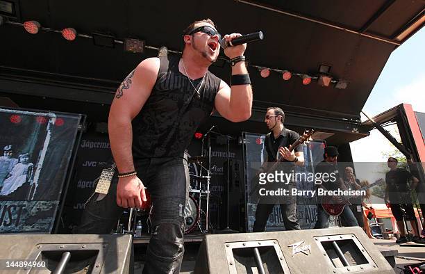 Musicians Dave Holowchak, Terry Freers and Paul Delmotte of Ghosts of August perform during the 2012 Rock On The Range festival at Crew Stadium on...