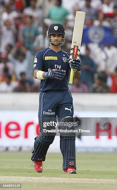 Deccan Chargers batsman Jean Paul Duminy raises his bat after completeing fifty in IPL 5 T20 match played between Deccan Chargers and Royal...