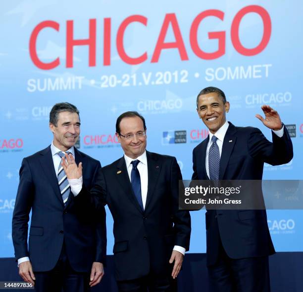 President Barack Obama and NATO Secretary General Anders Fogh Rasmussen greet French President Francois Hollande as he arrives at the NATO summit at...