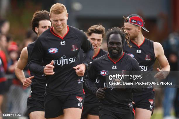 Anthony McDonald-Tipungwuti of the Bombers and Peter Wright of the Bombers in action during an Essendon Bombers AFL training session at The Hangar on...