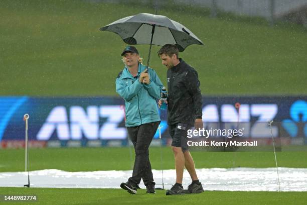 Match official Christelle High inspects the pitch with ground staff during game two of the One Day International series between New Zealand and...