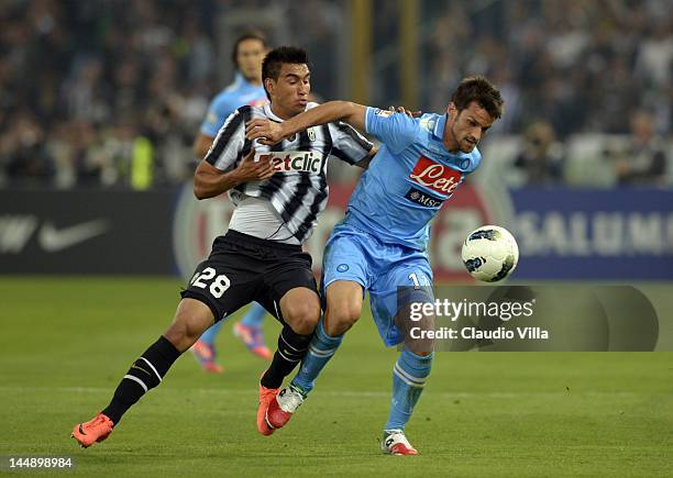 Marcelo Estigarribia of Juventus FC and Christian Maggio of SSC Napoli compete for the ball during the Tim Cup Final between Juventus FC and SSC...