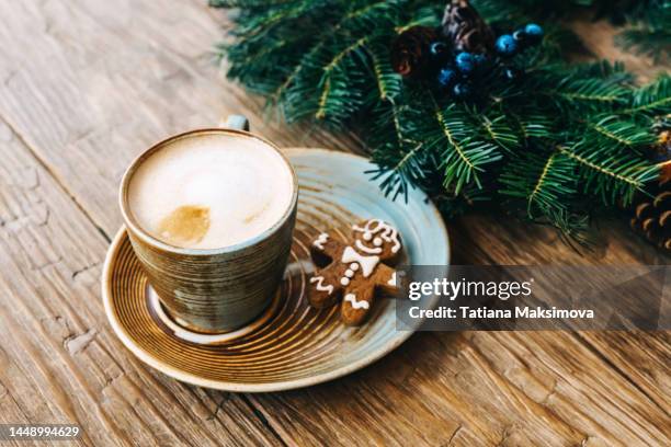 cappuccino in a beautiful ceramic cup on a wooden table. - christmas coffee imagens e fotografias de stock