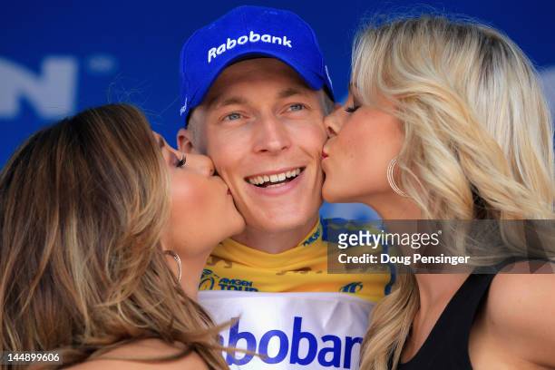 Robert Gesink of The Netherlands riding for Rabobank Cycling Team takes the podium after he defended the overall race leaders jersey in stage eight...