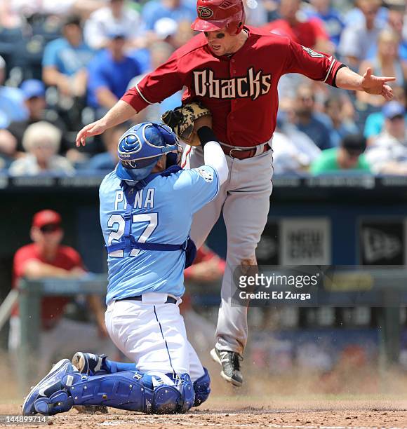 Aaron Hill of the Arizona Diamondbacks is tagged out by Brayan Pena of the Kansas City Royals as he tries to score in the fifth inning during an...