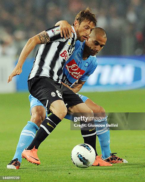 Claudio Marchisio of Juventus and Gkhan Inler of Napoli in action during the Tim Cup final match between Juventus FC and SSC Napoli at Olimpico...