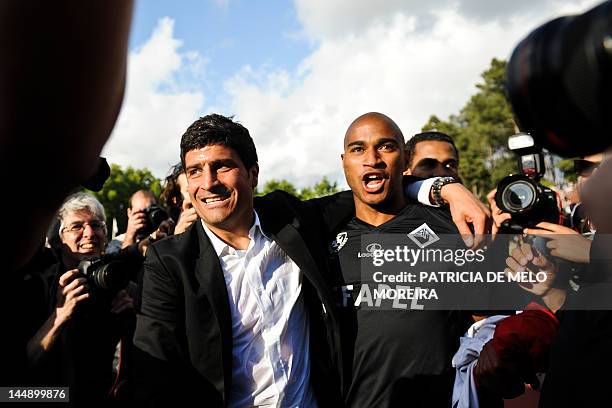 Academica's head coach Pedro Emanuel and Academica's Cape Verdean defender Nivaldo celebrate their team's victory over Sporting Lisbon during their...