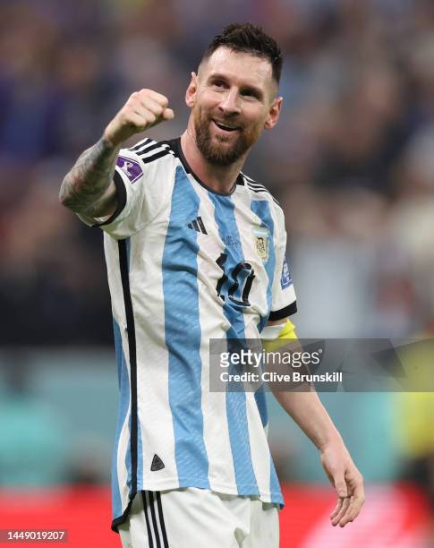 Lionel Messi celebrates after their sides third goal by Julian Alvarez of Argentina during the FIFA World Cup Qatar 2022 semi final match between...