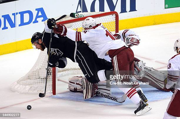 Rostislav Klesla of the Phoenix Coyotes throws the check against Jeff Carter of the Los Angeles Kings in Game Four of the Western Conference Finals...