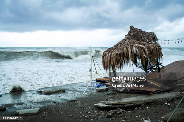 beach cafe damaged by sea storm - coastal deprivation stock pictures, royalty-free photos & images