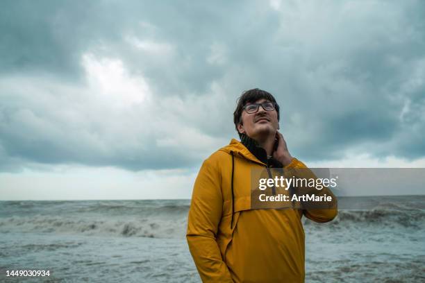 a man is worried about extreme weather and climate change - ecologist stock pictures, royalty-free photos & images