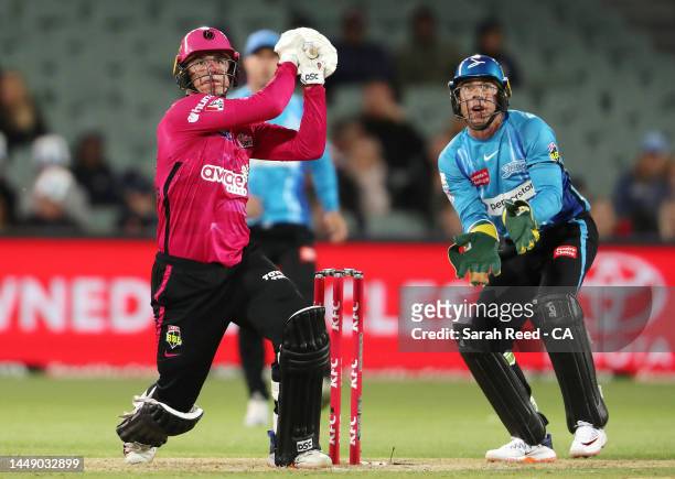 Moises Henriques of the Sixers and Harry Nielsen of the Strikers during the Men's Big Bash League match between the Adelaide Strikers and the Sydney...