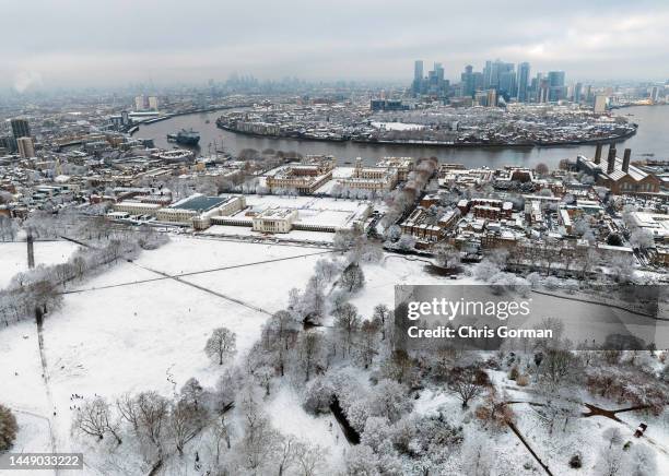 An aerial view across Greenwich Park to the Isle of Dogs after snow fell on December 12, 2022 in London, England.