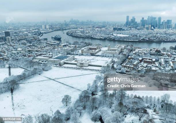 An aerial view across Greenwich Park to the Isle of Dogs after snow fell on December 12, 2022 in London, England.