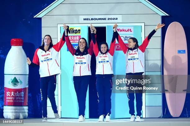 Silver medallists Rebecca Smith, Katerine Savard, Mary-Sophie Harvey and Taylor Ruck of Canada celebrate during the medal ceremony for the Women's...