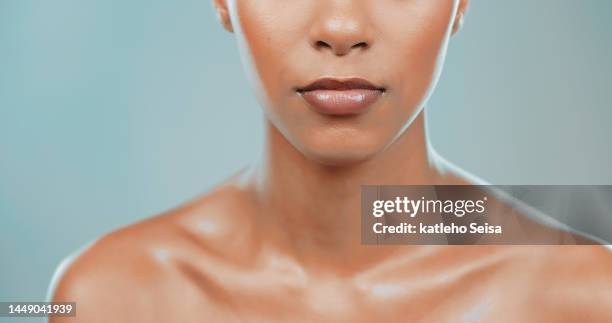 studio shot of attractive young woman with glowing skin - close up lips stock pictures, royalty-free photos & images