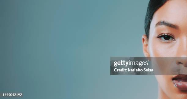 studio shot of confident female model showing half face - eye make up bildbanksfoton och bilder