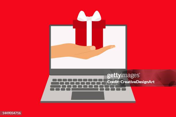 hand presenting gift box on laptop screen - applying wallpaper stock illustrations