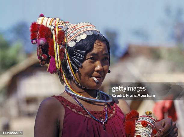 woman of the akha people smoking - akha stock pictures, royalty-free photos & images