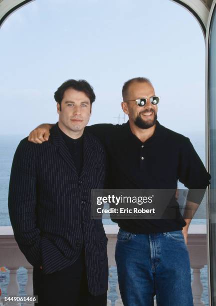 Actors John Travolta, left, and Bruce Willis in Cannes for the International Film Festival where their film 'Pulp Fiction' is showing, France, May...