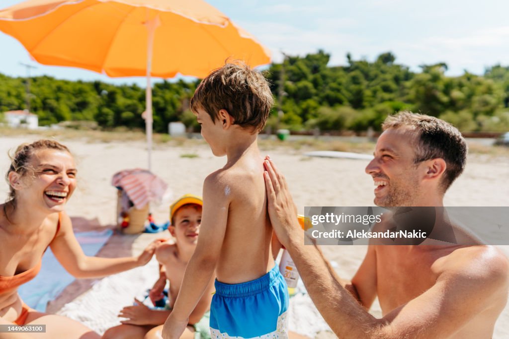Applying sunscreen while at the beach