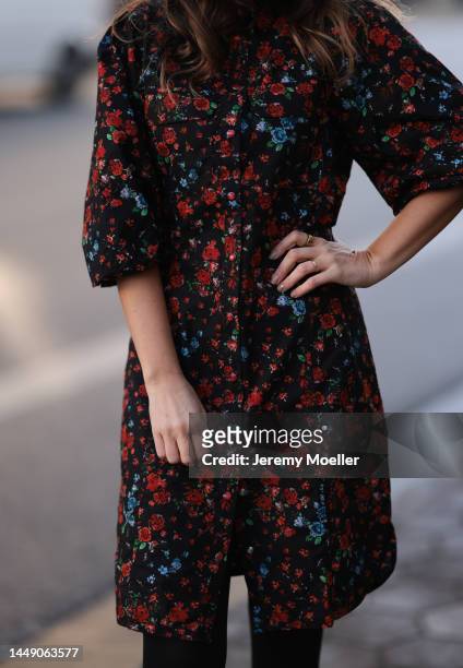 Anna Wolfers seen wearing a red and blue flower printed dress and black tightson December 09, 2022 in Hamburg, Germany.