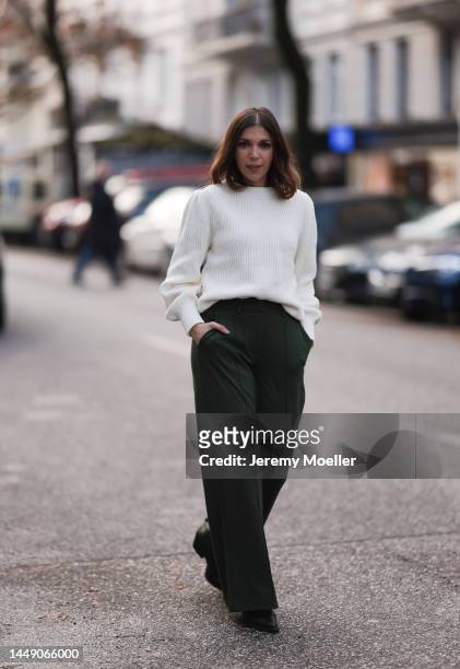Anna Wolfers seen wearing a white turtle neck sweater, green pants and black boots on December 09, 2022 in Hamburg, Germany.