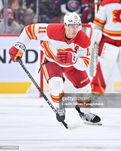 Mikael Backlund of the Calgary Flames skates against the Montreal Canadiens during the first period at Centre Bell on December 12, 2022 in Montreal,...