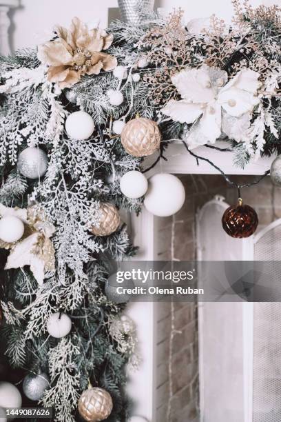 xmas branches and led garland over fireplace. - happy santa claus over white blank stock-fotos und bilder