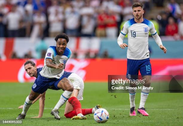 Raheem Sterling of England wins the ball off Adrien Rabiot of France during the FIFA World Cup Qatar 2022 quarter final match between England and...