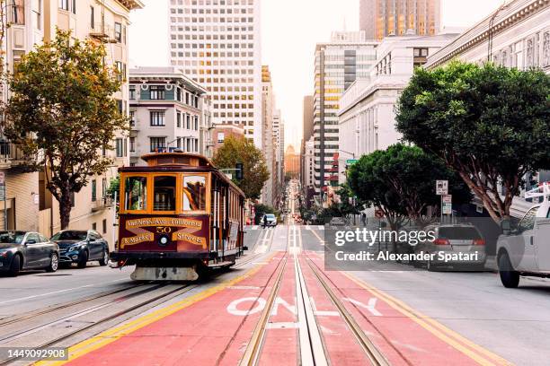 historic cable car on the street in san francisco, california, usa - san francisco photos et images de collection