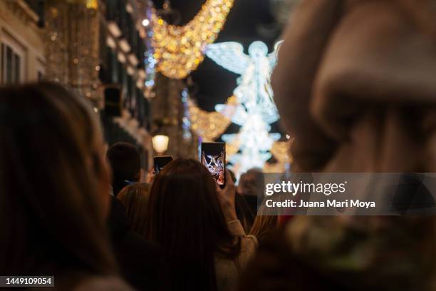 illumination of christmas 2022 of calle larios, malaga, andalusia, spain - carol singer stock pictures, royalty-free photos & images
