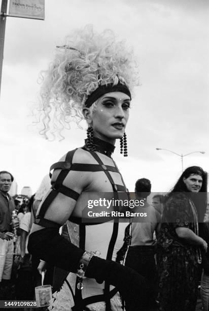 Portrait of an attendee, in a blond wig and corset, during Wigstock, an annual drag festival, in Tompkins Square Park, New York, New York, September...