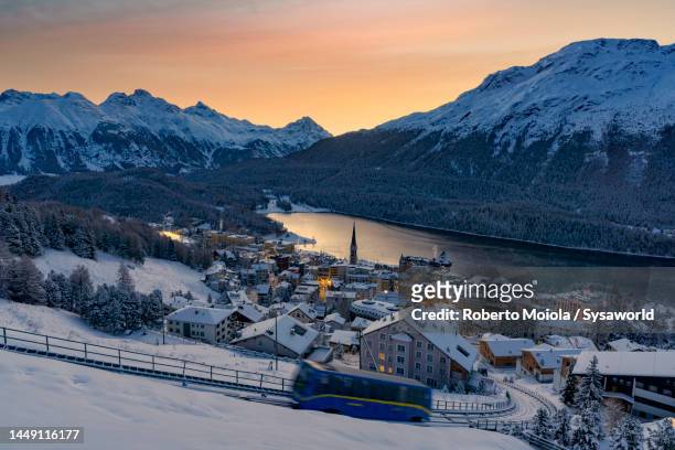 funicular on snowy slopes above st moriz at dawn - st moritz stock pictures, royalty-free photos & images